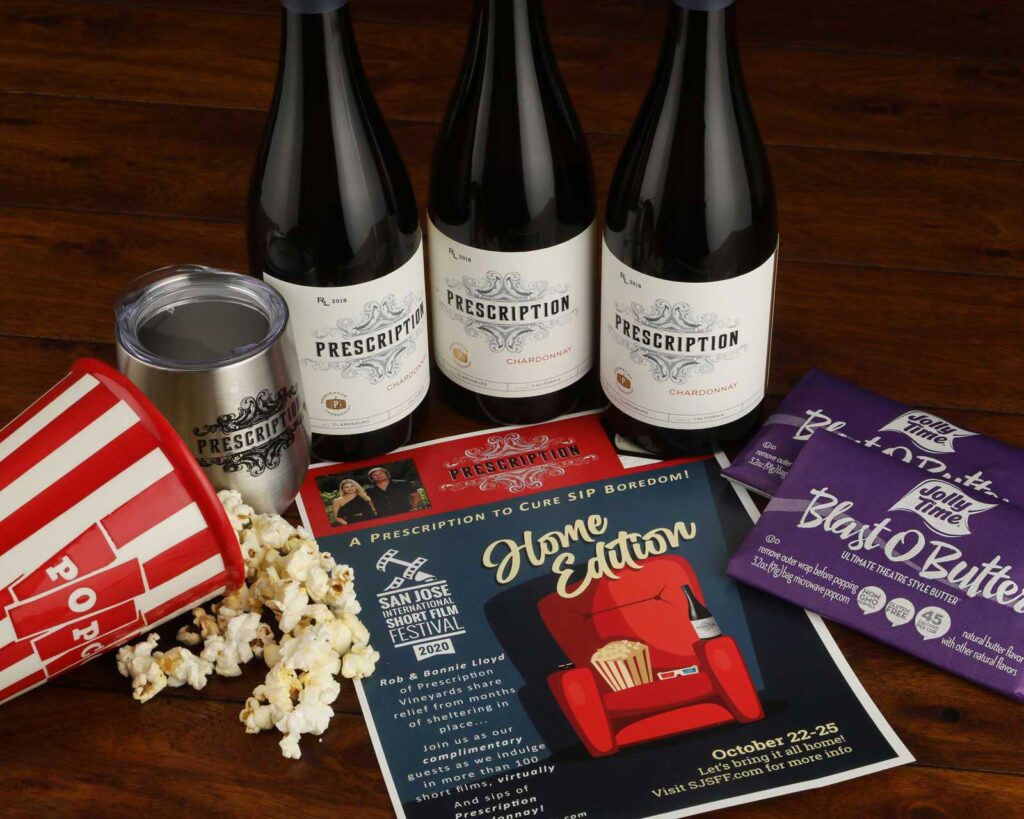 image of popcorn and wine bottles with movie flyer